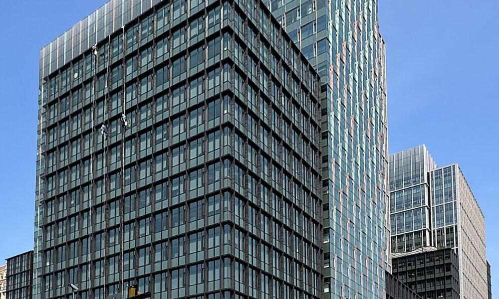 Amazon HQ2 office buildings photographed in 2026, illustrative of Amazon corporate operations
