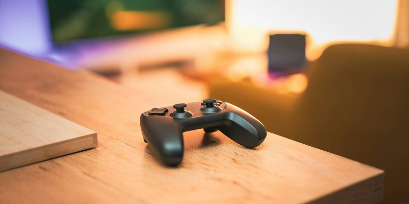 Game controller on a cool-toned gaming background