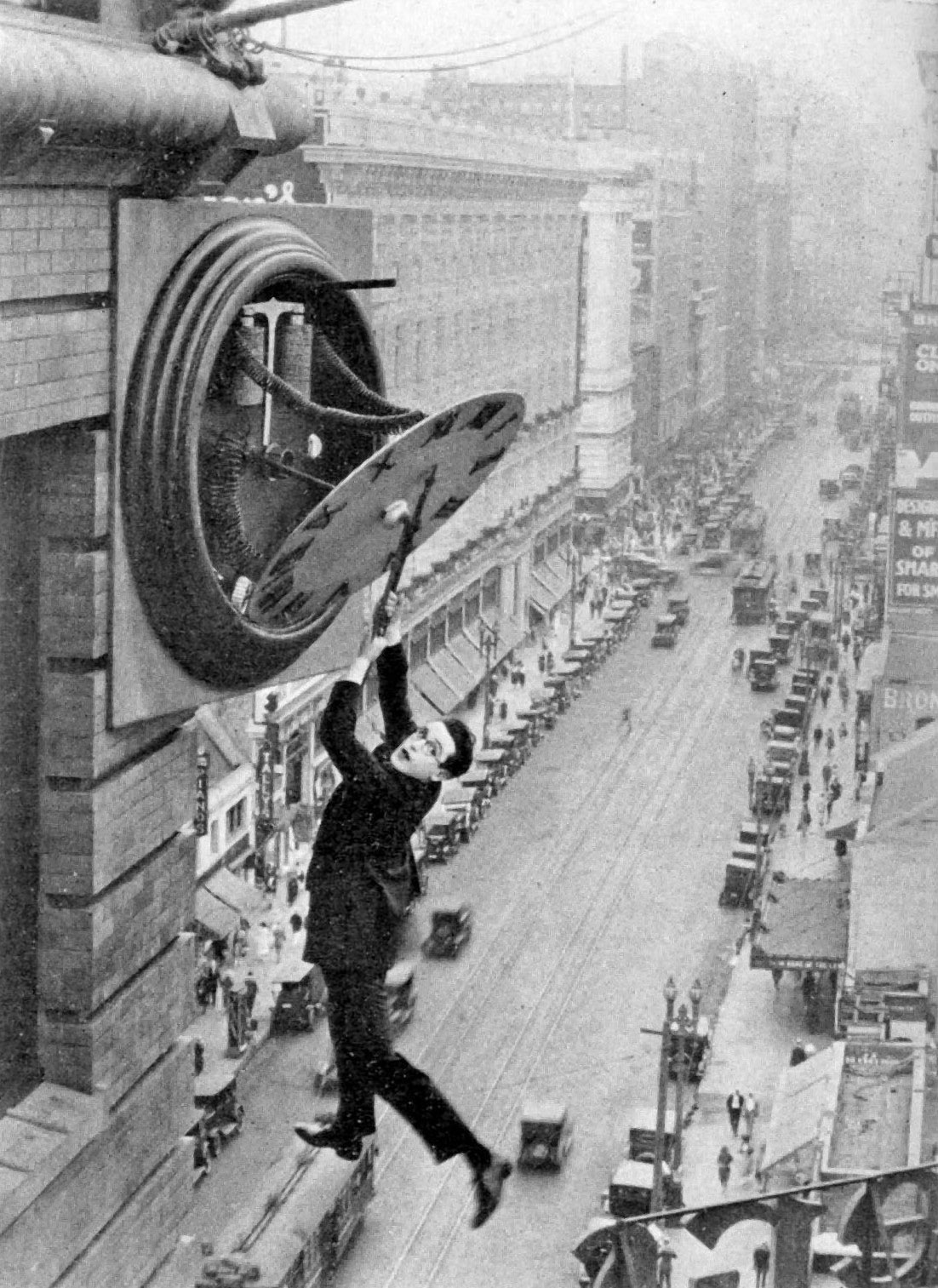 Historical photograph of Harold Lloyd in the 1923 silent comedy Safety Last showing a physical performance