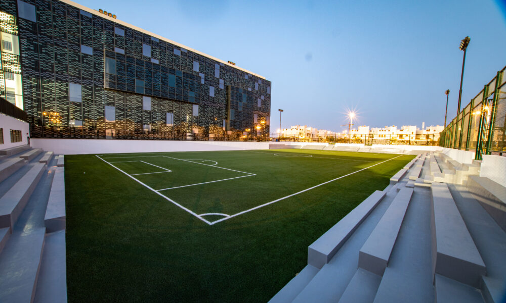 Wide football pitch with marked rectangular field and football goals
