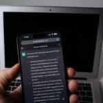 ChatGPT AI assistant on smartphone and laptop
