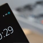 Close-up photograph of a smartphone display with an airplane mode indicator among its status icons