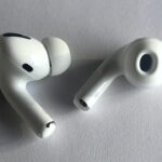 Two Apple AirPods Pro wireless earbuds photographed close up