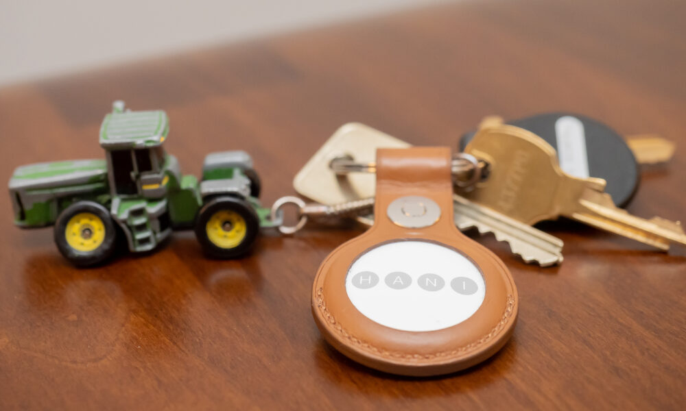 Close-up photograph of an Apple AirTag tracking accessory
