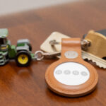 Close-up photograph of an Apple AirTag tracking accessory