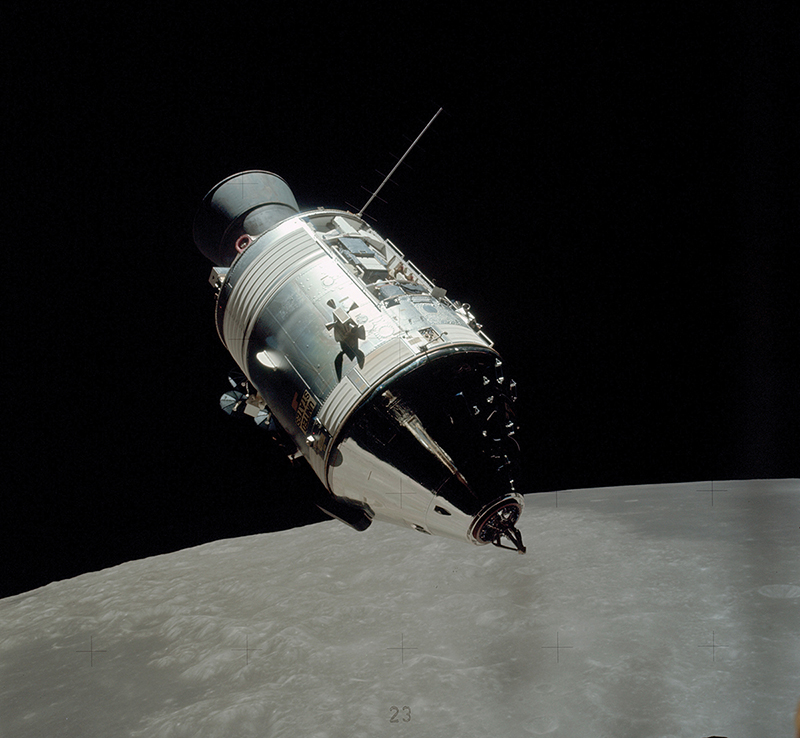 Real Apollo command and service module photographed above the Moon, showing the cone-shaped capsule and cylindrical propulsion and support section