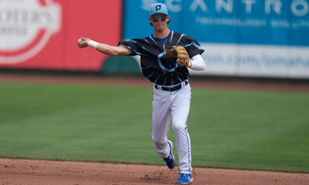 Baseball infielder Bobby Witt Jr fields a ground ball and prepares a throw