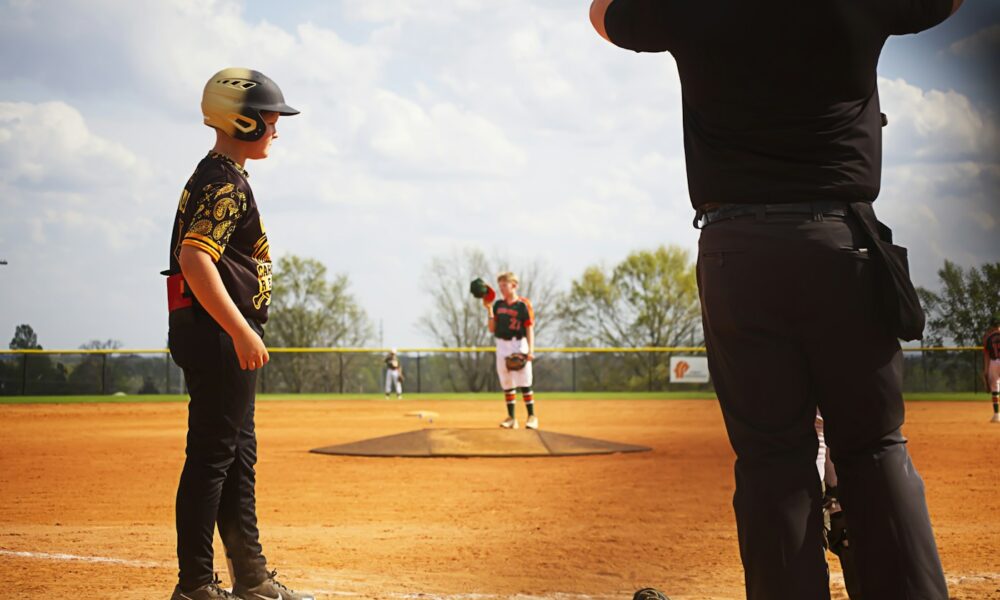 An authentic Little League baseball game during play, illustrating youth baseball run-rule context