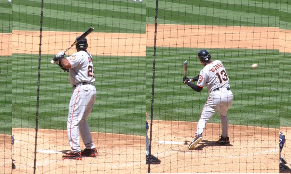 Barry Bonds swinging a baseball bat during a game in Seattle
