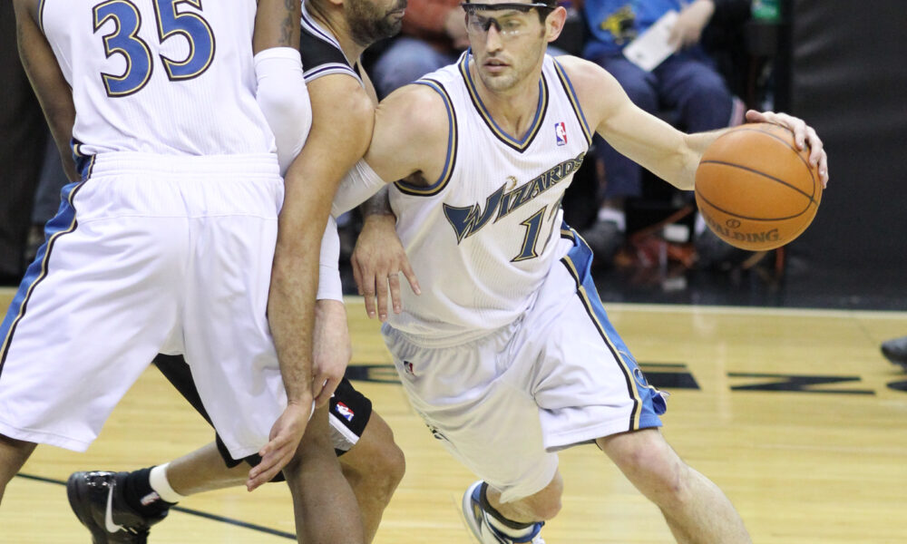 Basketball players running a pick and roll action