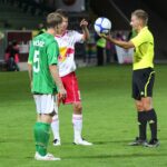Referee holding ball for a soccer dropped-ball restart