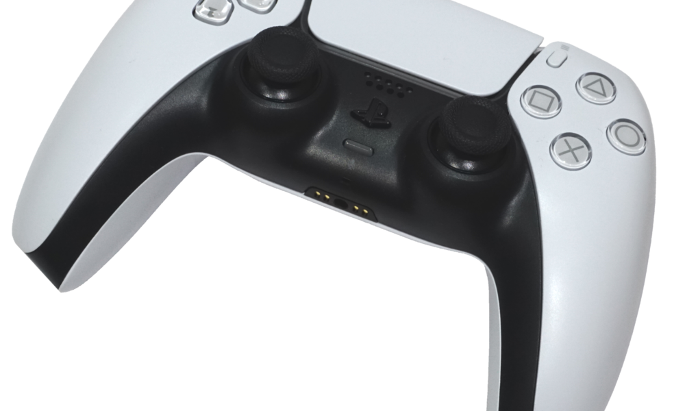 Real white PlayStation DualSense controller photographed against a plain background