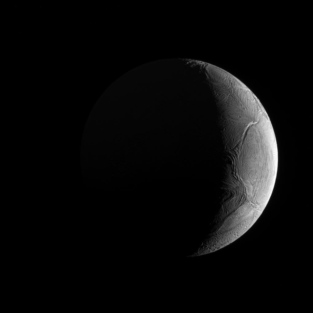 Real Cassini spacecraft photograph of the bright icy globe of Enceladus taken on November 27 2016