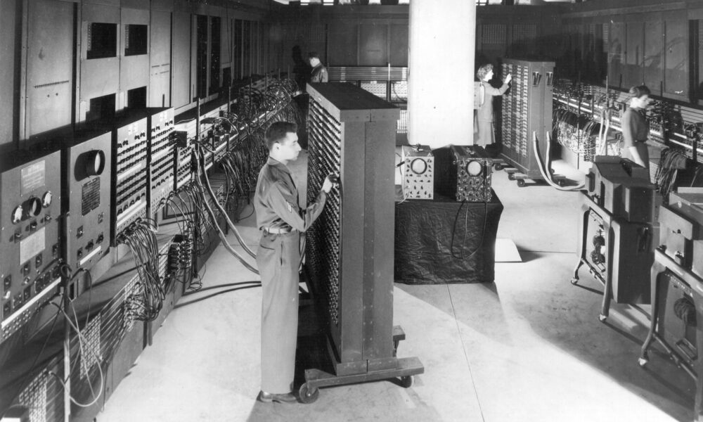 U.S. Army 1946 photograph of technician working with control panels of the ENIAC computer
