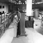 U.S. Army 1946 photograph of technician working with control panels of the ENIAC computer