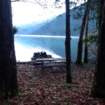 Actual lakeside walk-in campsite at Fairholme Campground in Olympic National Park, with picnic table near Lake Crescent