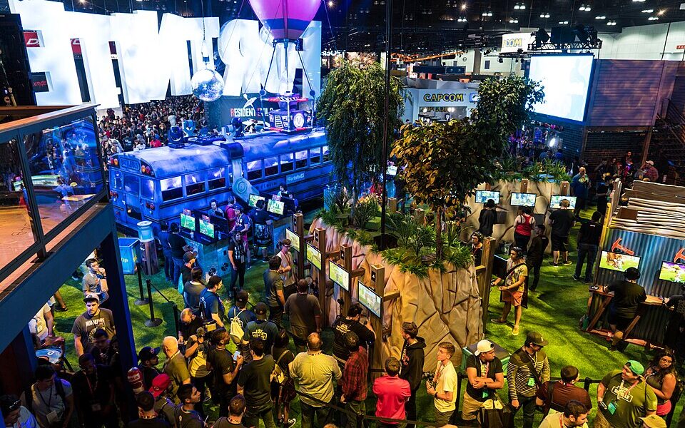 Fortnite-branded exhibition stand at E3 2018 illustrating the Fortnite add-friends guide