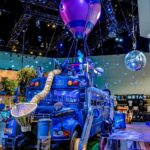 Fortnite display at E3 2018 illustrating Fortnite Gift Card and V-Bucks Card redemption