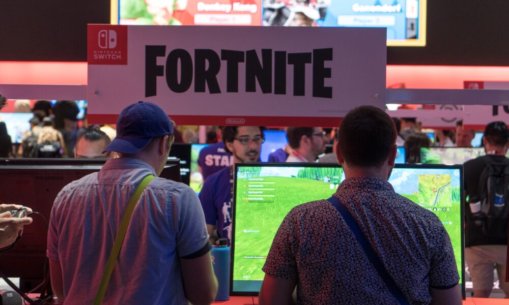 Fortnite players at the E3 gaming exhibition, used as an editorial image for PC performance troubleshooting