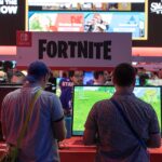 Players testing Fortnite at E3 2018 illustrating split-screen multiplayer setup