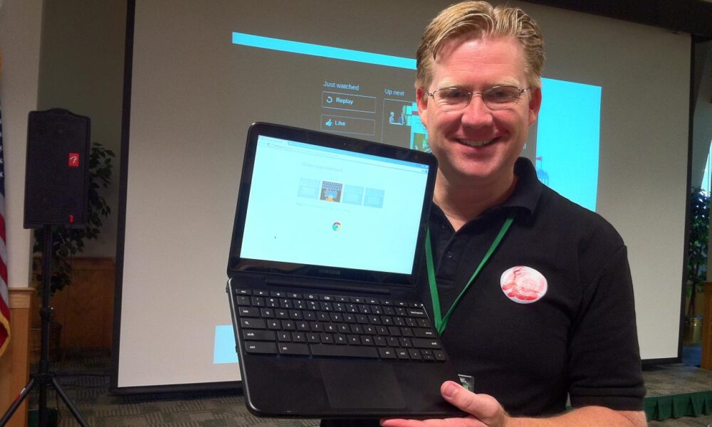 Actual photograph of a Google Chromebook laptop with keyboard and trackpad