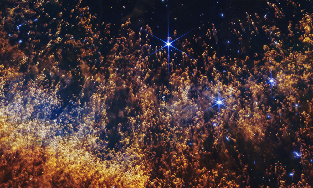 Authentic James Webb 2026 released NIRCam infrared view of Helix Nebula NGC 7293 with comet-like dust knots and stars