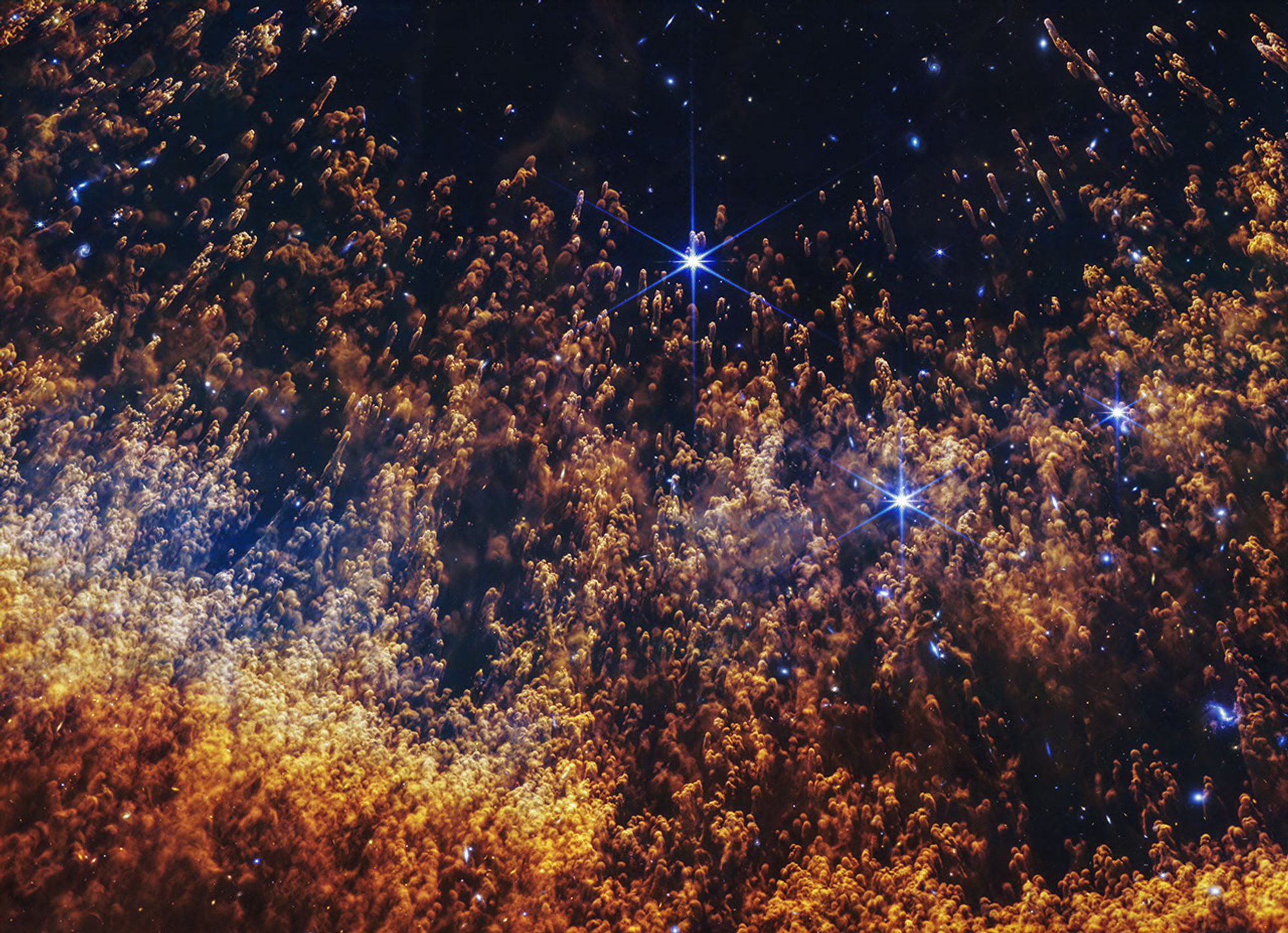 Genuine NASA James Webb NIRCam 2026 image of the Helix Nebula with thousands of golden comet-like knots and bright background stars