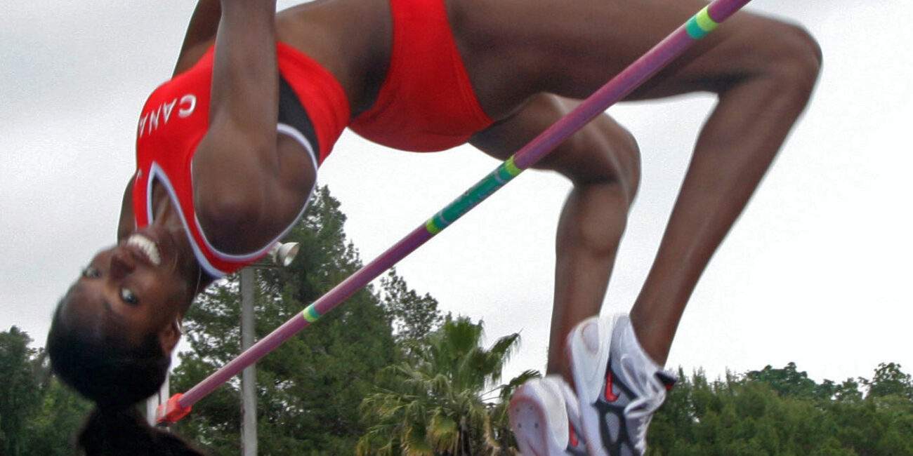 Canadian high jump athlete Nicole Forrester performing a high jump using the Fosbury flop technique