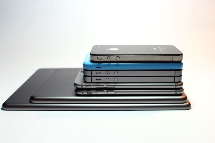 Real photograph of Apple mobile devices including an iPhone used to illustrate speaker care