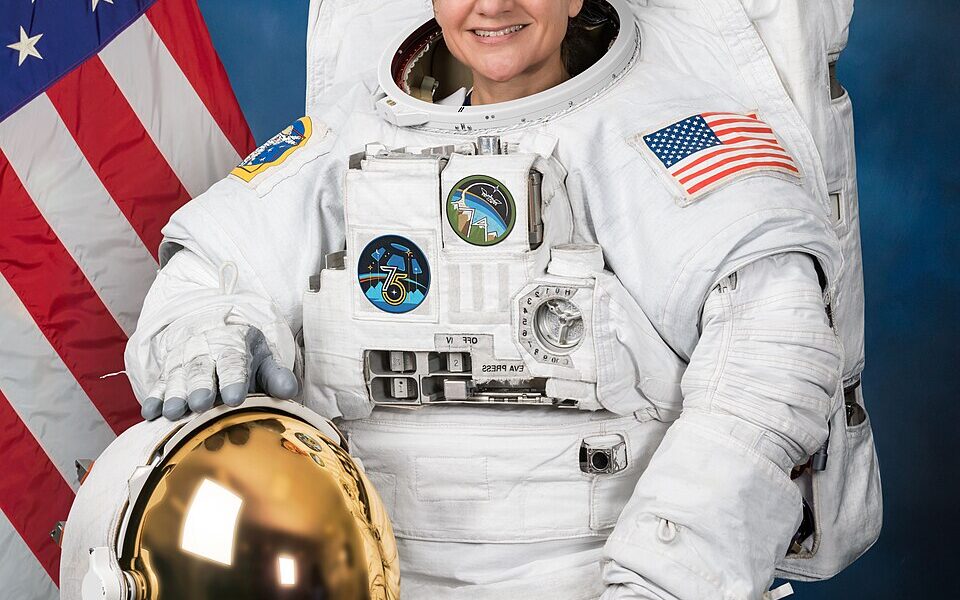 Jessica Meir in a real NASA extravehicular spacesuit in her official 2025 astronaut portrait