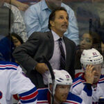 NHL coach John Tortorella behind the bench with the New York Rangers in a hockey game