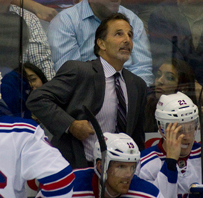 NHL coach John Tortorella behind the bench with the New York Rangers in a hockey game
