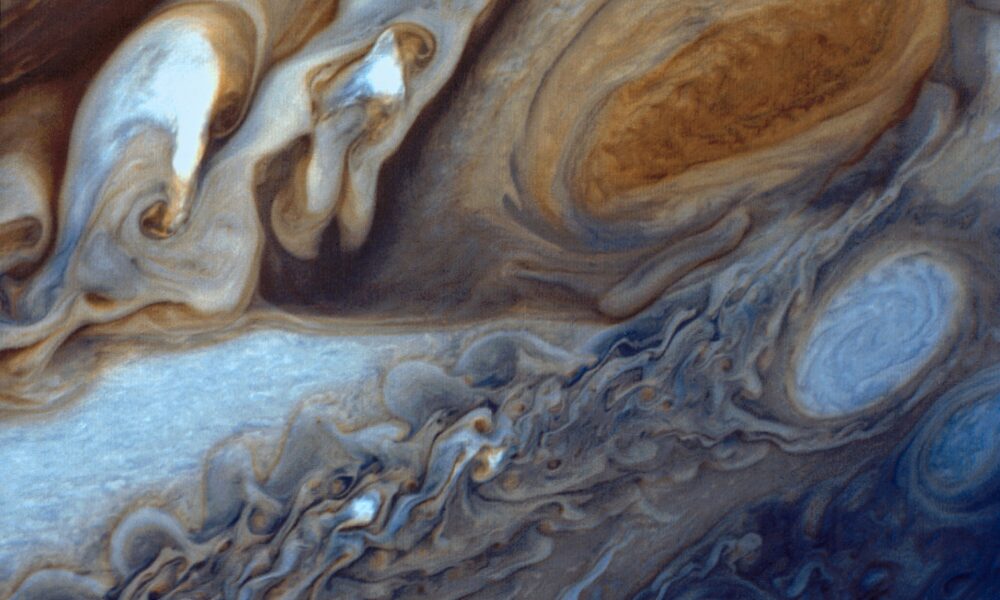 NASA Voyager 1 real color view of Jupiter's Great Red Spot storm and swirling clouds captured during the 1979 flyby