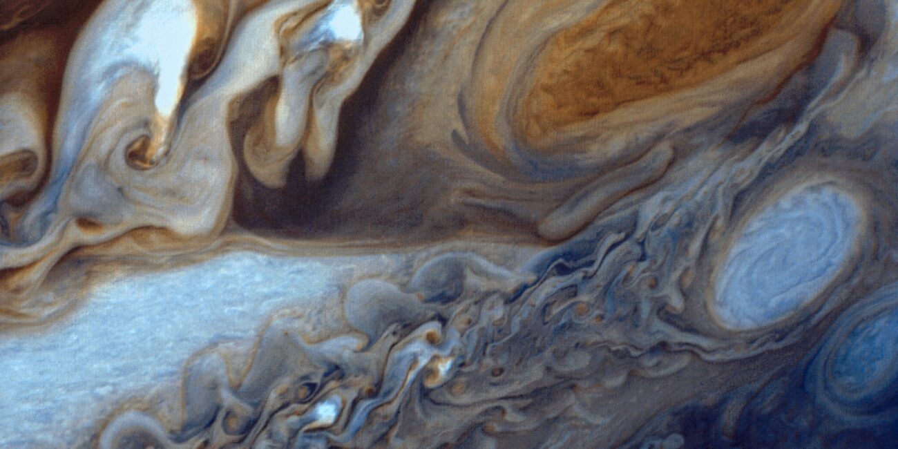 NASA Voyager 1 real color view of Jupiter's Great Red Spot storm and swirling clouds captured during the 1979 flyby