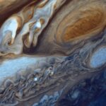 NASA Voyager 1 real color view of Jupiter's Great Red Spot storm and swirling clouds captured during the 1979 flyby