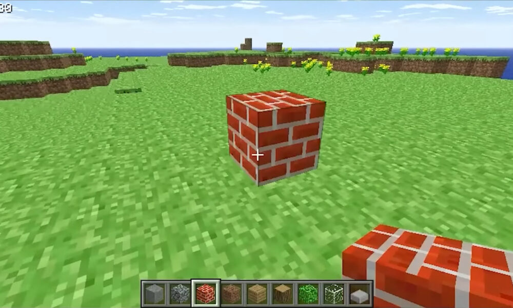 Minecraft Classic version 0.30 gameplay screenshot with brick blocks, grassy terrain and the original block hotbar