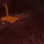 Screenshot of the Nether dimension in Minecraft, showing its distinctive block-based terrain