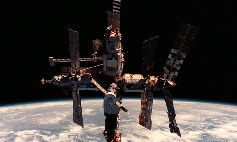 NASA's authentic 1998 STS-91 photograph of the Mir space station against Earth's atmosphere