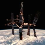 NASA's authentic 1998 STS-91 photograph of the Mir space station against Earth's atmosphere