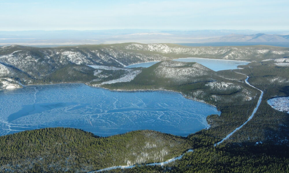 Archival aerial winter view of actual Newberry Caldera in Oregon, showing Paulina Lake, East Lake and the Central Pumice Cone