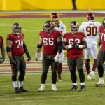 Tampa Bay Buccaneers offensive line preparing before a snap in an American football game