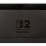 Nintendo Switch 2 console seated in its TV docking station, photographed from the front