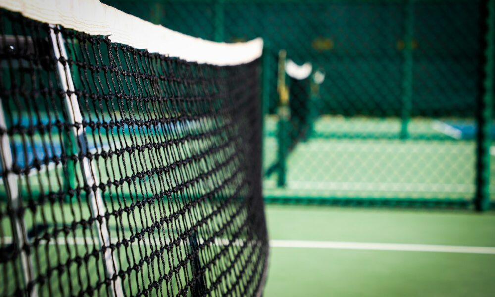 Real outdoor pickleball court in Saddlebrooke, Arizona, showing playing lines and net