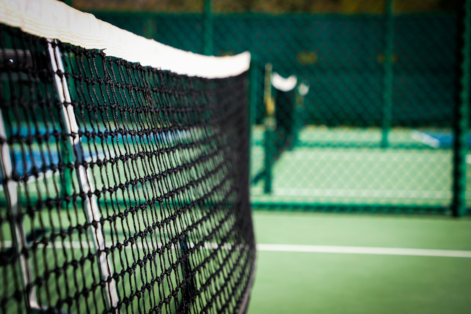 Real pickleball court with a net and painted court boundaries in Saddlebrooke, Arizona