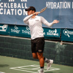 Ben Johns playing pickleball at a doubles tournament in Newport Beach