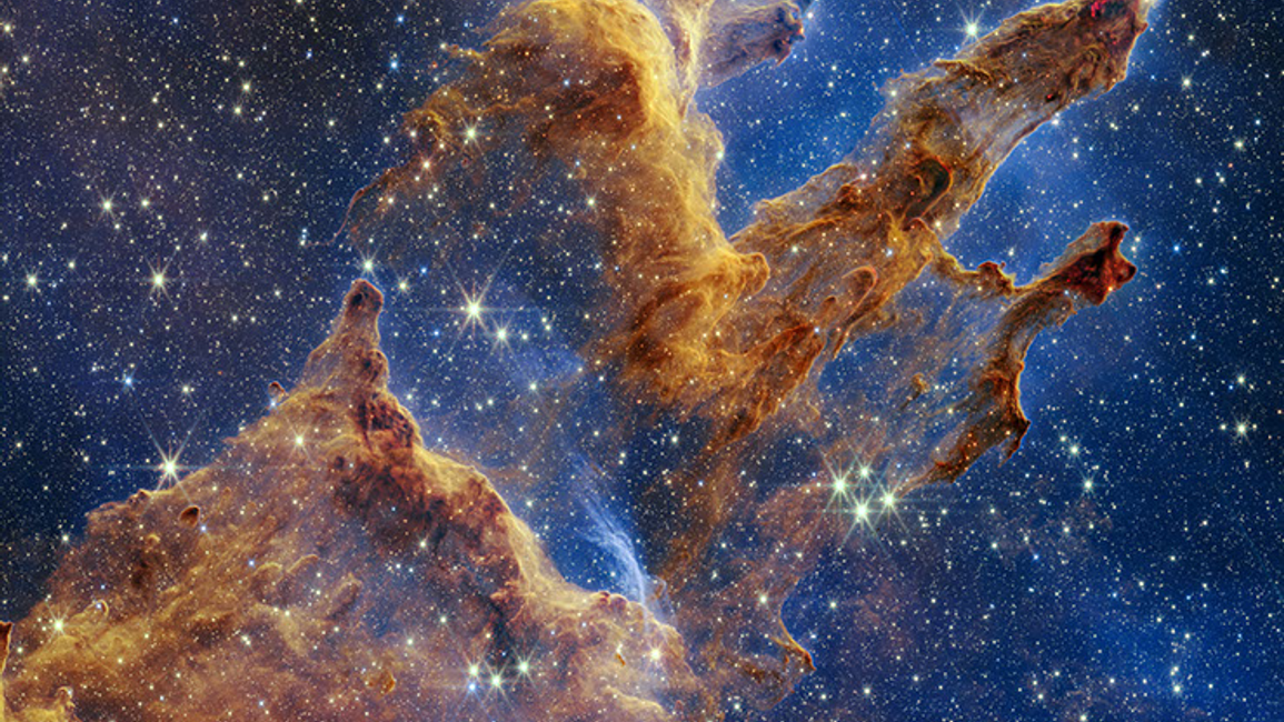 Real NASA James Webb telescope NIRCam infrared photograph of the Pillars of Creation in Eagle Nebula M16 with dusty columns and young stars