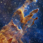 Real NASA James Webb telescope NIRCam infrared photograph of the Pillars of Creation in Eagle Nebula M16 with dusty columns and young stars