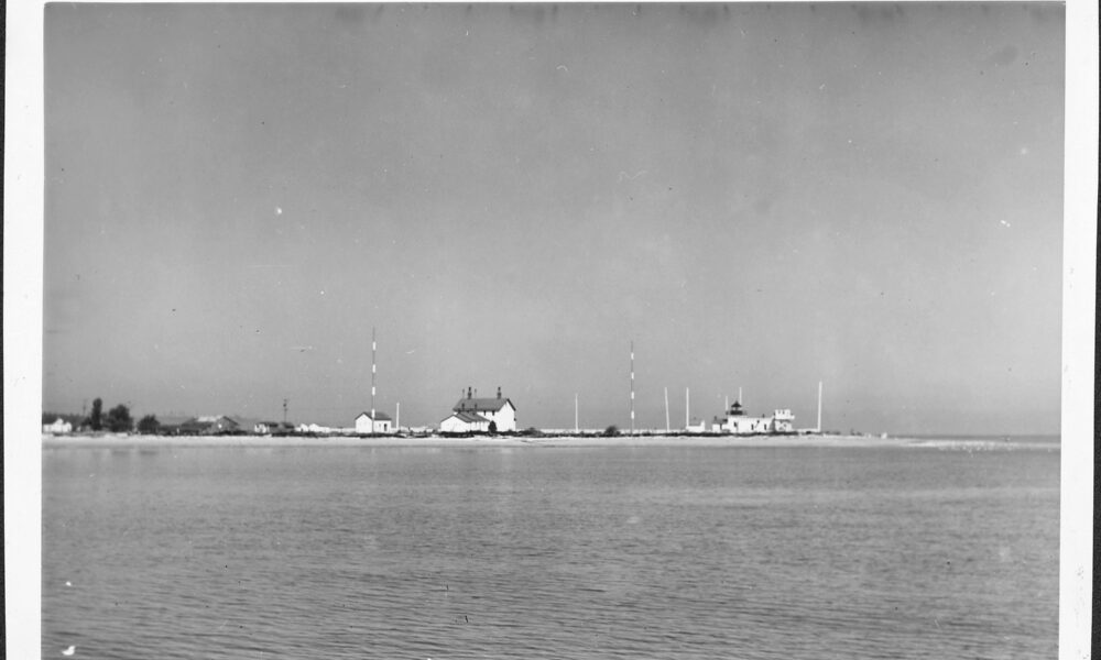 Historical July 1944 U.S. Coast Guard photograph of real Point No Point shoreline and lighthouse in Hansville, Washington
