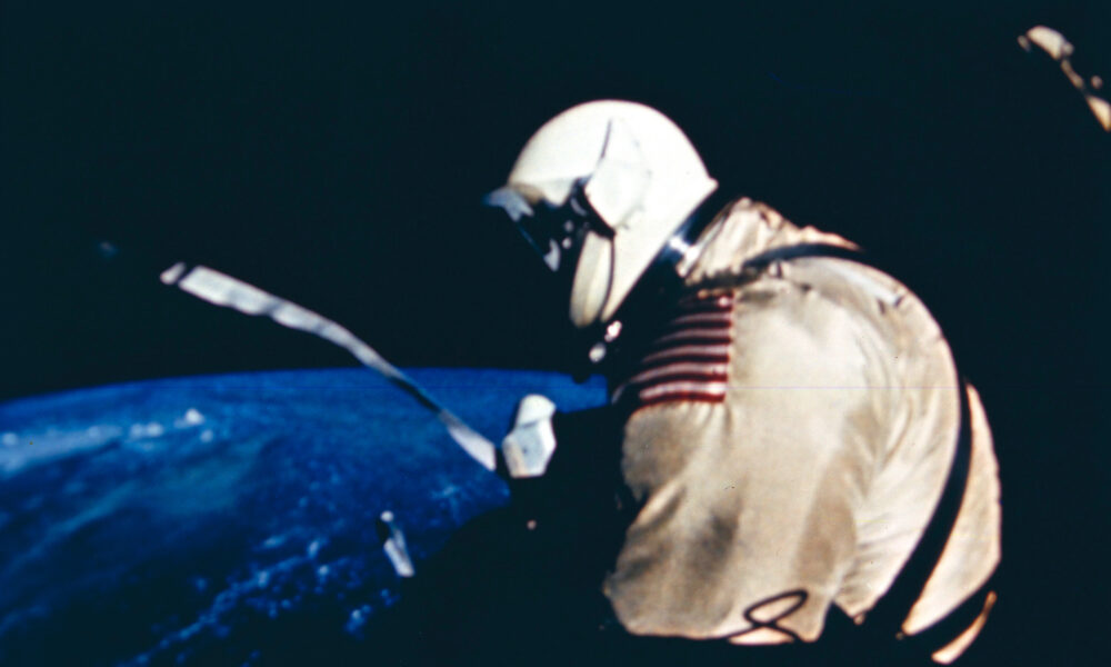 Actual NASA Gemini IV 1965 first American spacewalk photograph showing astronaut Ed White above Earth