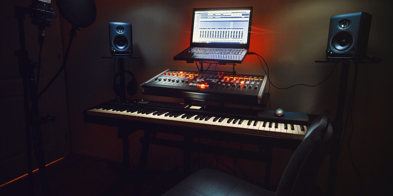 Real home audio recording studio with microphone and laptop